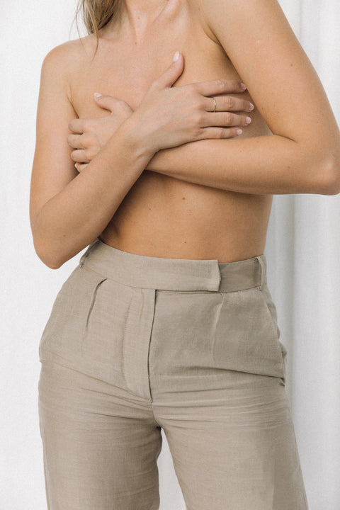 Close-up of taupe linen trouser waistband